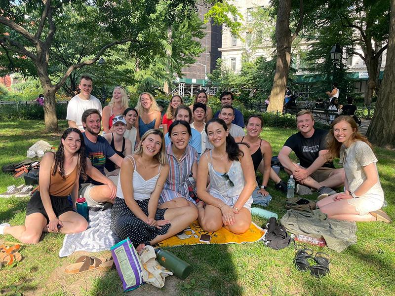 Members of eight Altman cohorts having a picnic.